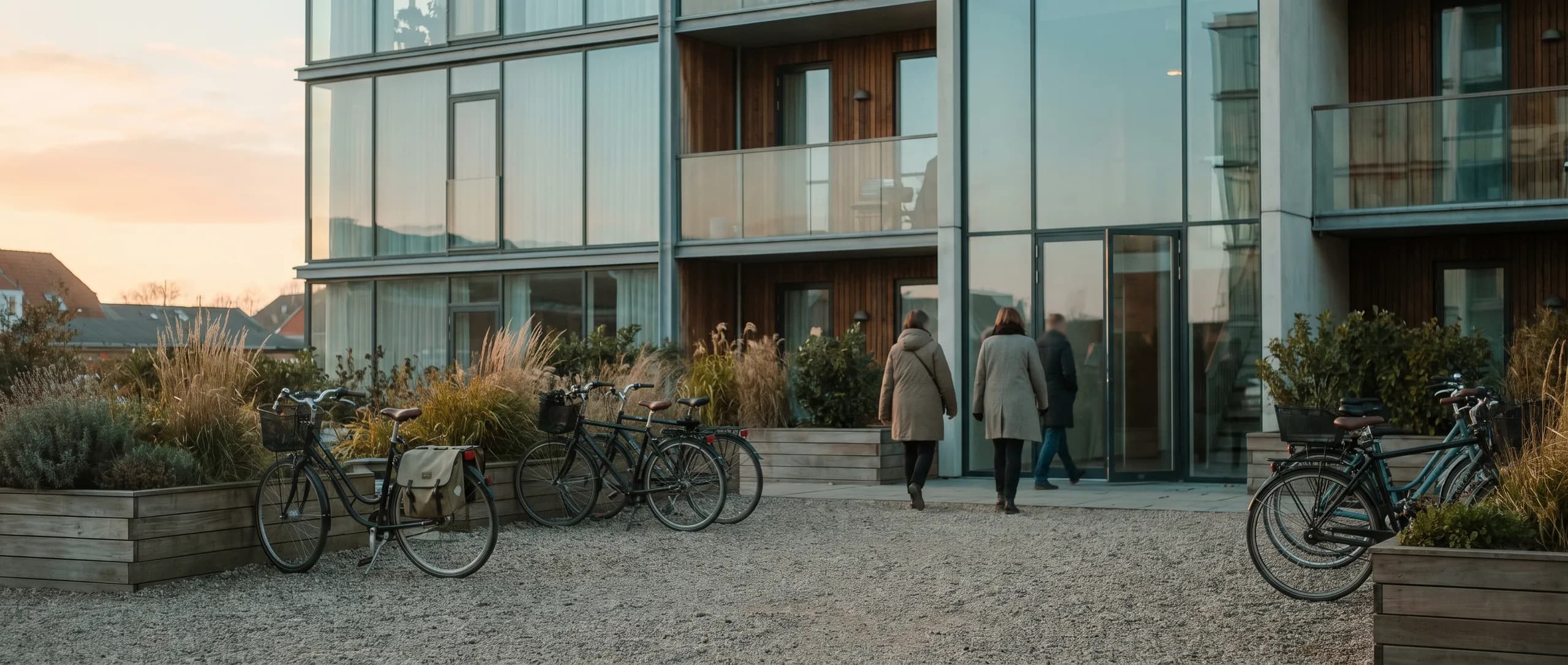 The courtyard of an apartment block in late-afternoon light
